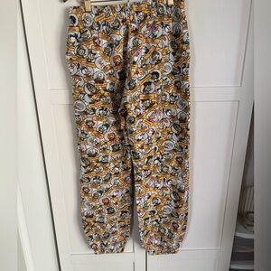 Disney Duck Family Scrooge Daisy+ Allover Joggers Pants Pockets